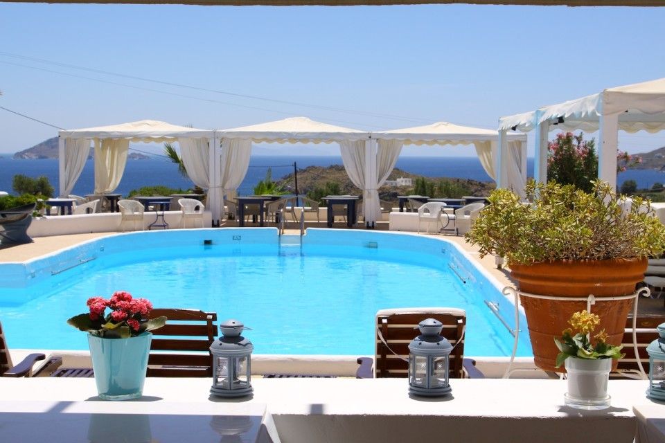 Pool area with cabanas and sea view